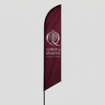 Heavy-duty custom outdoor advertising banner displayed with reinforced hem and wind slits